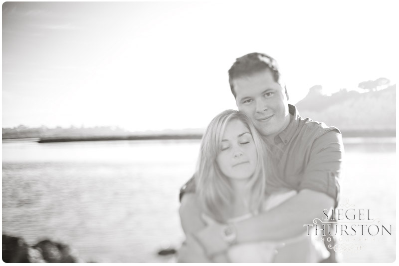 artistic engagement photos on the water at the beach