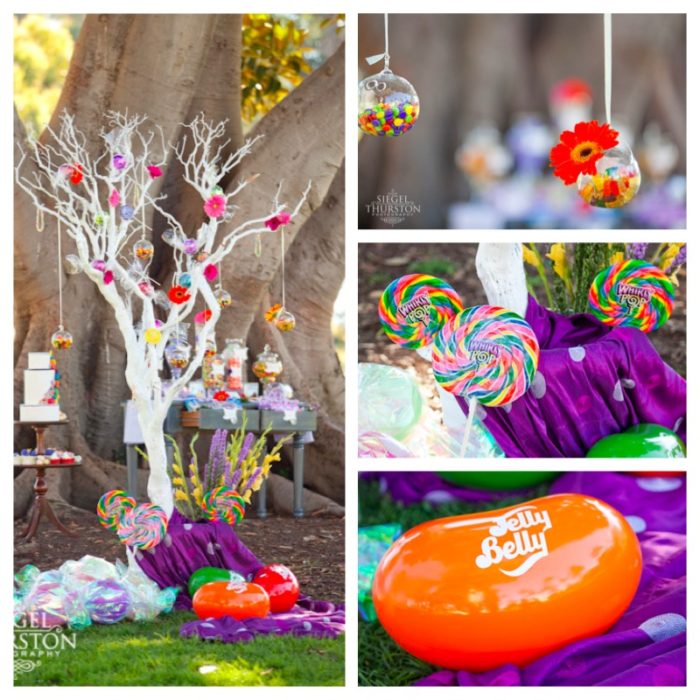 white tree decoration with glass balls full of candy strung in it